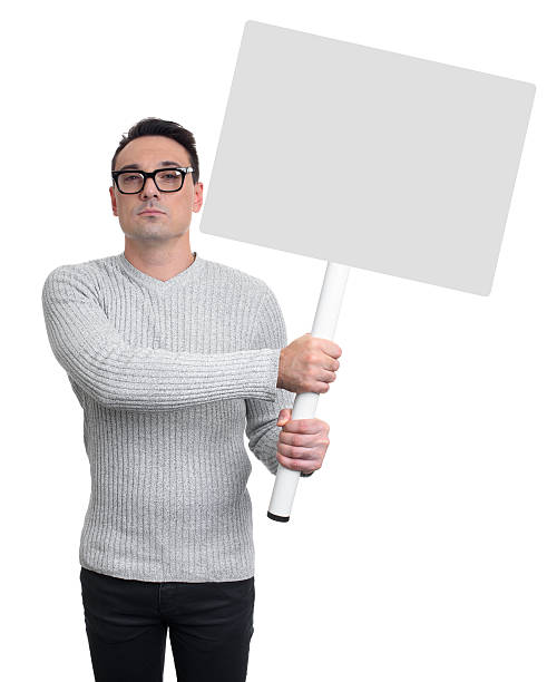 istock handsome man holding a white banner. Isolated 609832358