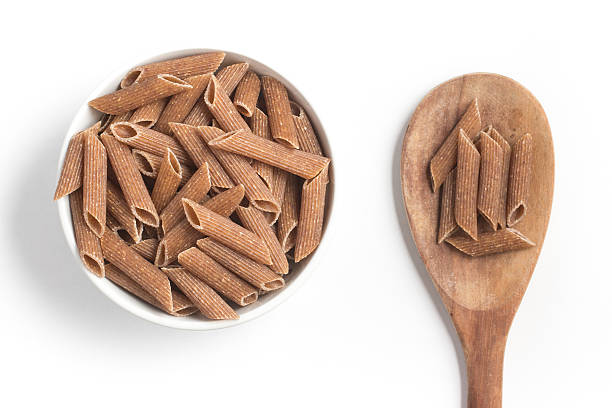 istock Wholemeal Pasta. Integral Penne into a bowl 609833064