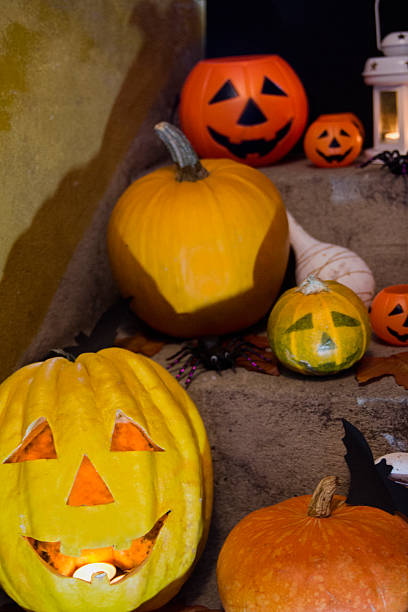 istock Halloween pumpkin head jack lantern on wooden background 609833202