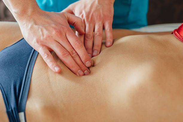 istock Doctor is examing his patient stomack. 609833562