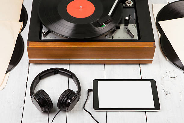 istock Vintage turntable, smartphone and headphones 609835886