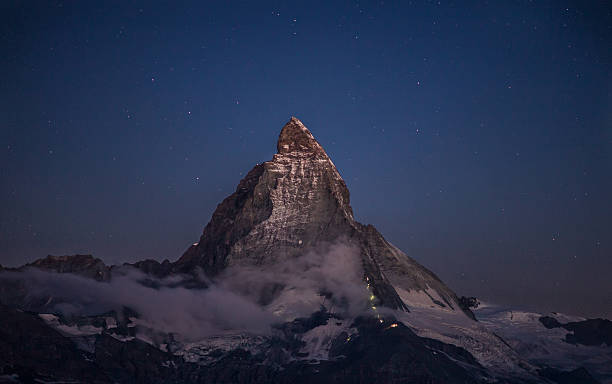 istock Matterhorn and the climbers at night 609836484