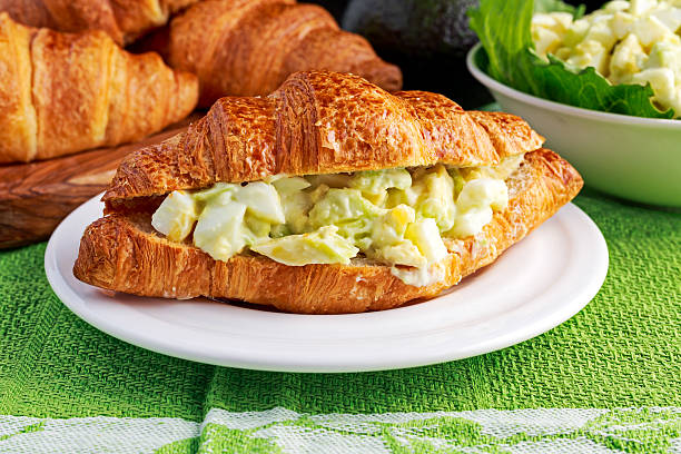 istock Morning Breakfast Croissant with avocado, egg salad 609836604