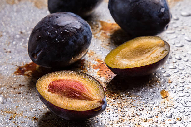 plums on steel plate