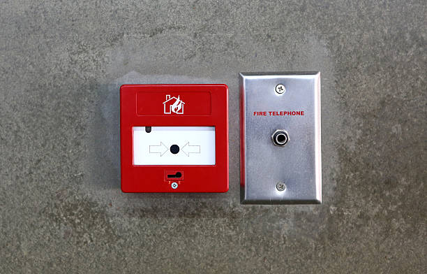 istock Fire break glass Fire alarm in the alarm on wall 609837358