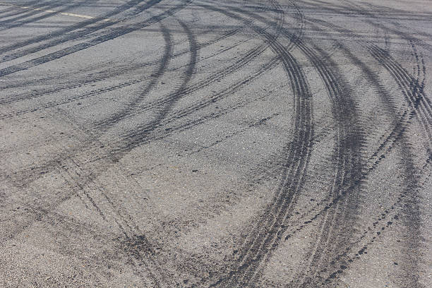 istock Abstract road background with tracks of tires 609837614