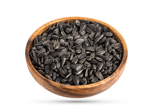 istock Black Sunflower seeds isolated on white, top view 609837706