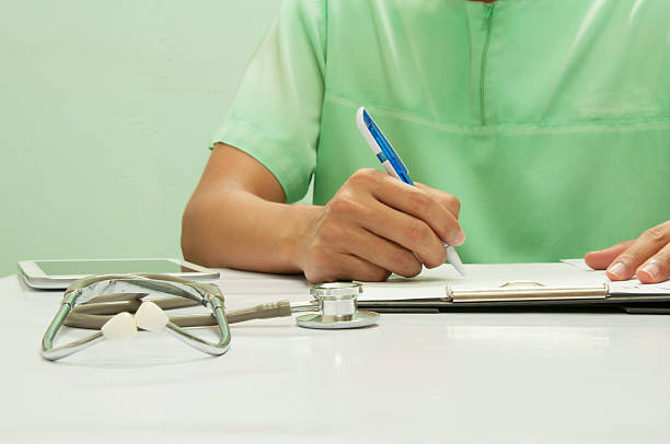 istock Doctor writing a medical prescription. 609837868