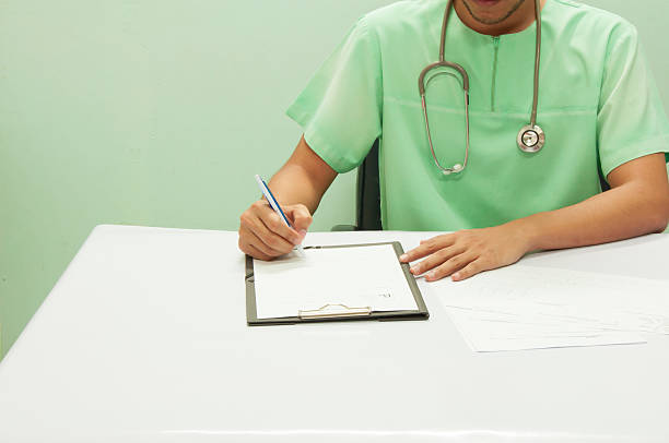 istock Doctor writing a medical prescription. 609837970