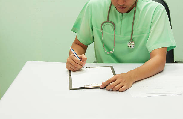 istock Doctor writing a medical prescription. 609838018