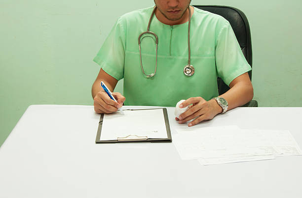 istock Doctor writing a medical prescription. 609838132