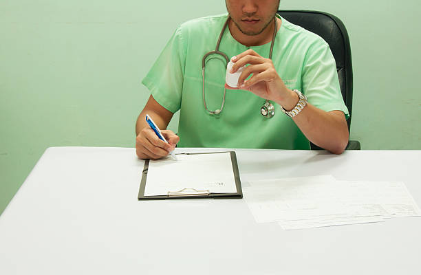 istock Doctor writing a medical prescription. 609838168
