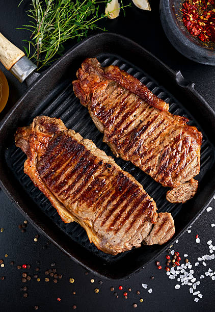 istock Fresh cooked meat Beef Steak Sirloin for two. in iron 609902124