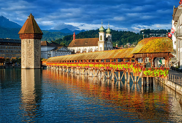 istock Lucerne, Switzerland, flower decorated Chapel Bridge and Water Tower 609905426