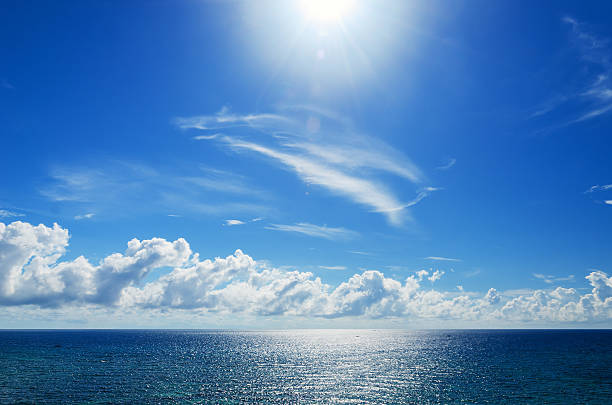 Tropical seascape and cloudy blue sky background