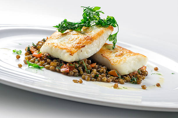 Turbot with crispy lentil Zollino Fish Dish Turbot with crispy lentil Zollino turbot stock pictures, royalty-free photos & images