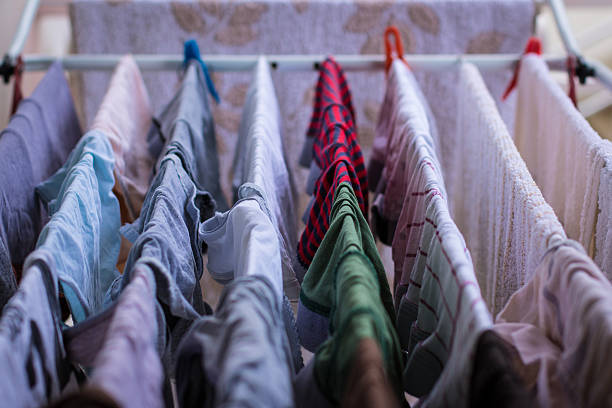 istock Colorful clothes hung out dries in the dryer 609908924