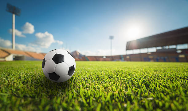 istock Soccer ball on the grass in soccer stadium 609909480