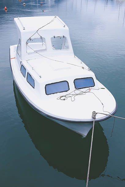 istock empty boat on the morning lake. 609910148