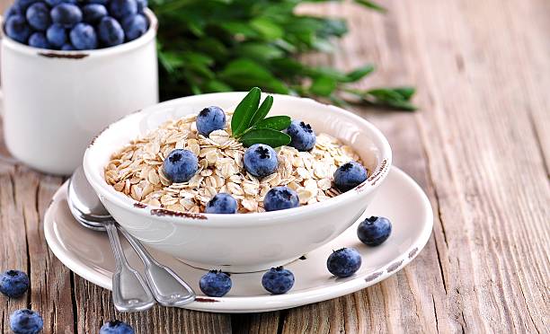 istock Oat flakes Quick cooking with blueberries. Healthy breakfast. 609910242