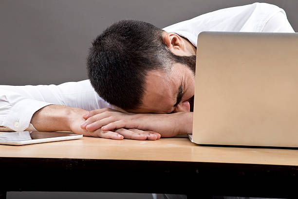 istock Businessman resting on the table 609911820