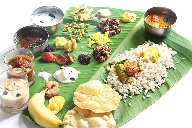 istock Onam feast on banana leaf isolated on white 609911960