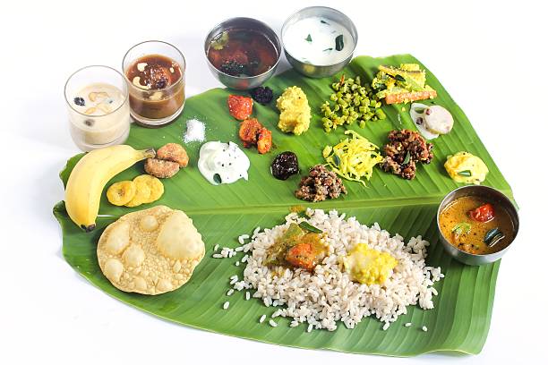 istock Onam feast on banana leaf isolated on white 609912054