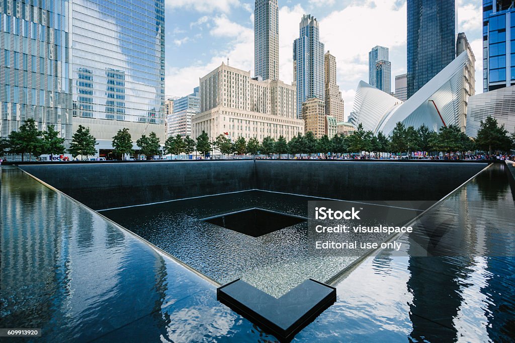 11 September 2001 Memorial in New York New York, USA - September 7, 2016:  South pool memorial commemorating the victims of the 11 september terror attack in 2001. New York architecture in the background. 911 Remembrance Stock Photo