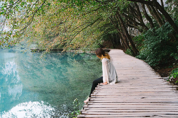 istock Woman in Plitvice National Park 609916852