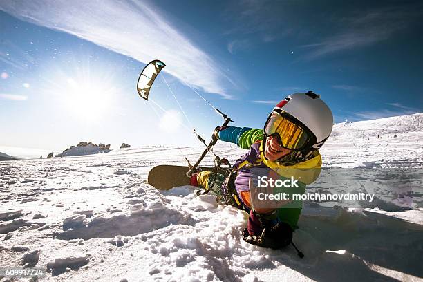 Snowboarder Skydives On Blue Sky Backdrop In Mountains Snowfall Stock Photo - Download Image Now