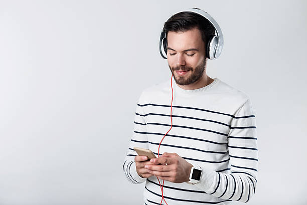 istock Satisfied bearded man listening to music. 609917742