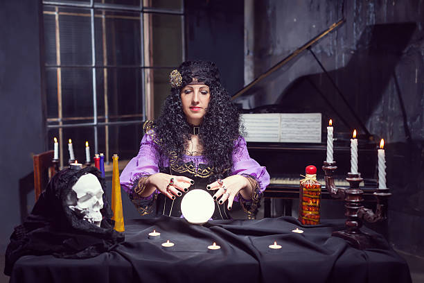 istock Sorceress in her room 609918840