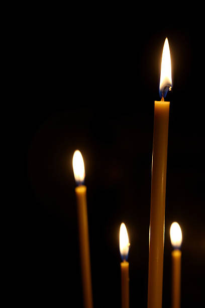 istock burning in the dark taper candles 609919298