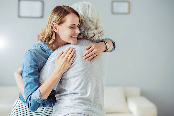 istock Positive woman embracing with her mother 609923666