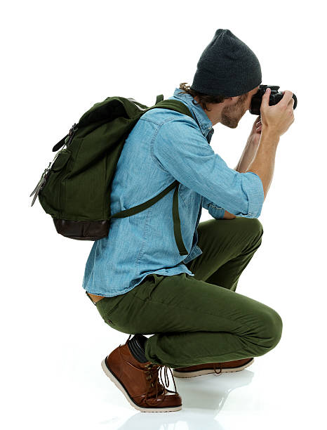istock Photographer in action with camera 609928258