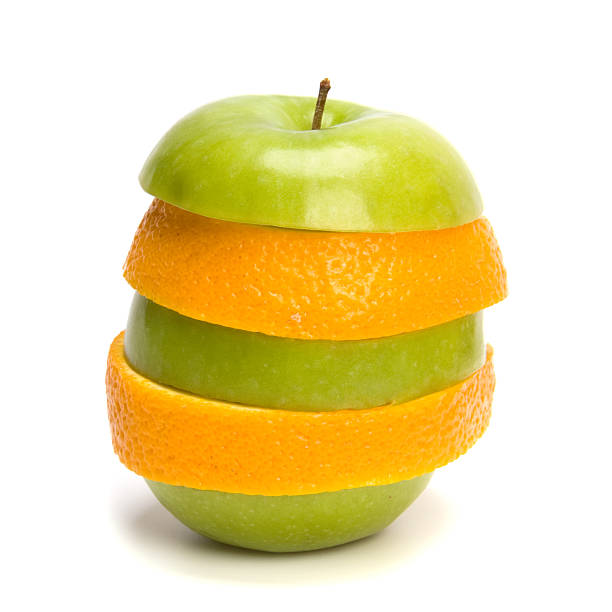 istock mixed sliced fruits and pills isolated on white background 609928324