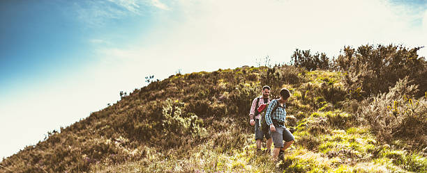 istock group of people hiking the mountain togetherness 609930198