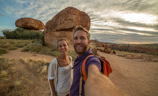 istock Selfie portrait of two young adults at the Devil's Marbles 609930402