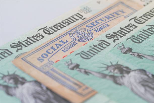 istock Partial view of Social Security card and US Treasury checks 609930814
