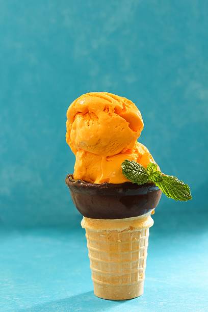 Homemade Mango icecream in a cone, selective focus