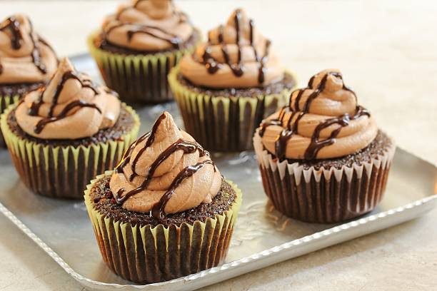 istock Homemade Chocolate Cupcakes with buttercream frosting, selective focus 609931306