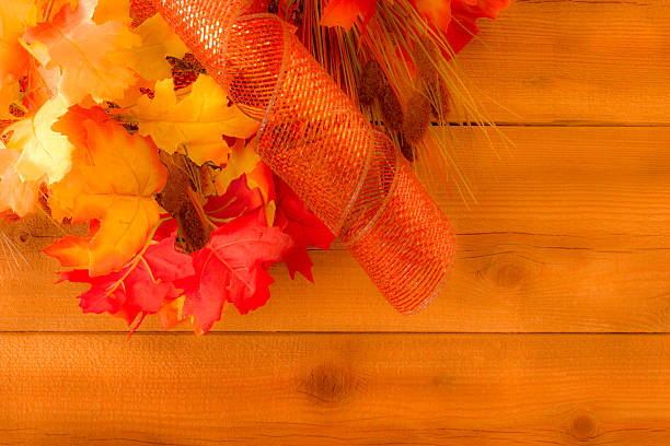 istock Rustic wood wall with fall leaves and ribbon background(P) 609931818