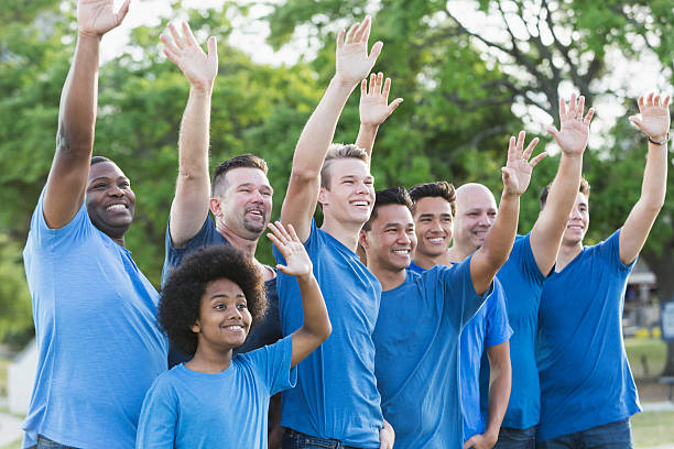 istock Multi-ethnic group of fathers and sons in blue shirts 609931842