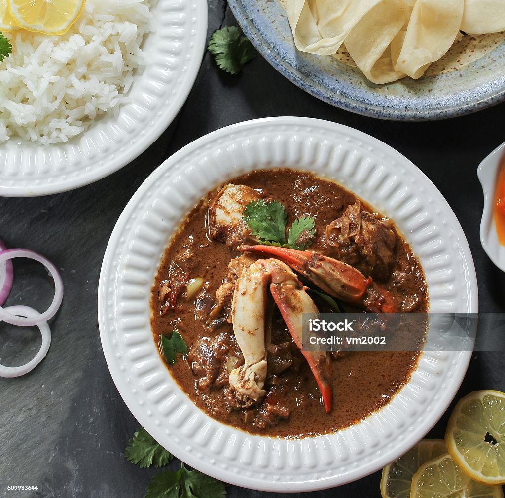 Crab curry served with rice and Rumali roti Crab curry / Kerala Crab Masala served with basmati rice and Rumali roti, selective focus Basmati Rice Stock Photo