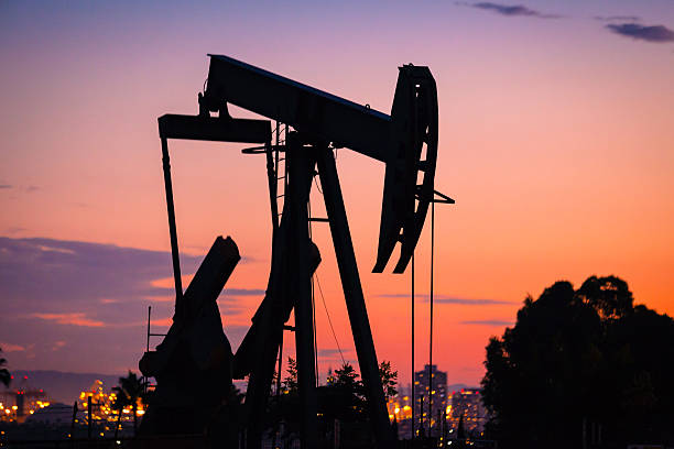 Pumpjack Silhouette At Sunset In Signal Hill,  Overlooking Long Beach stock photo