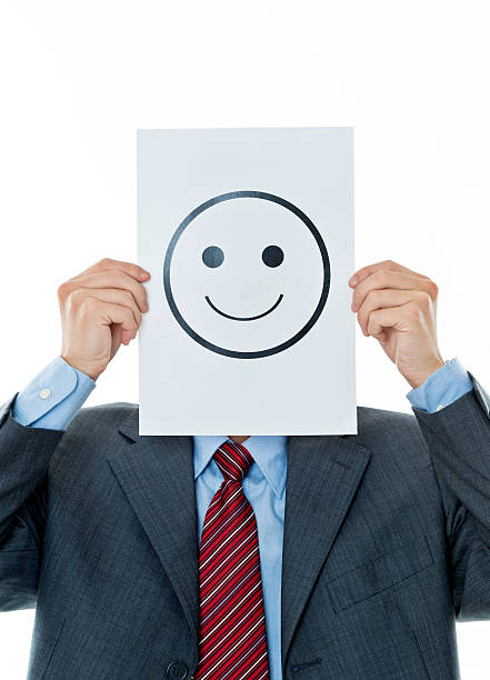 istock Businessman holding paper with smiley face 609937066
