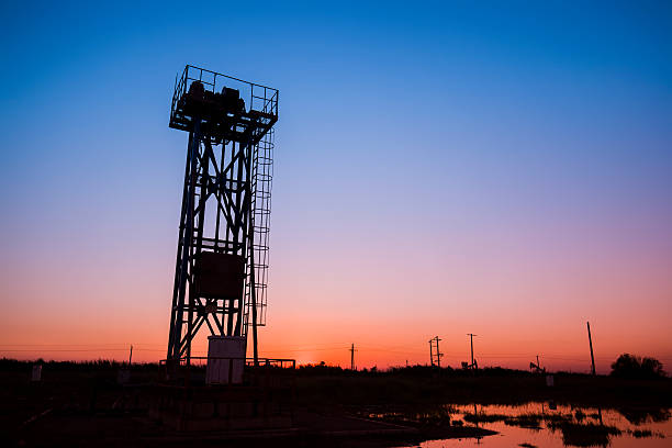 istock The silhouette of tower type pumping unit 609940998