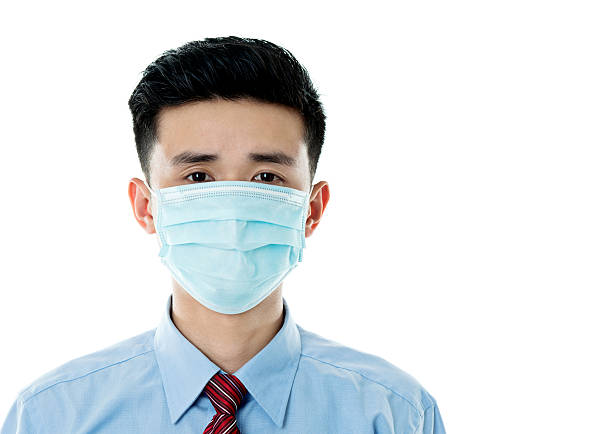 Caucasian Very sad ill mature woman wearing a surgical mask