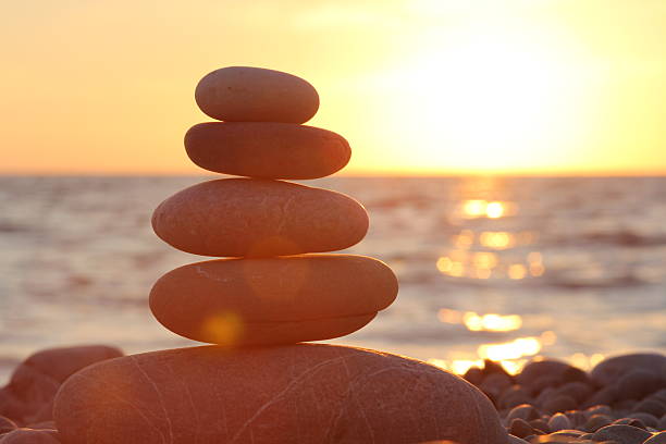 istock Zen stones sunset sea peace of mind concept 609946138
