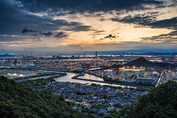 Japanese factories in the early evening at sunset. Okayama, Japan. March 2016